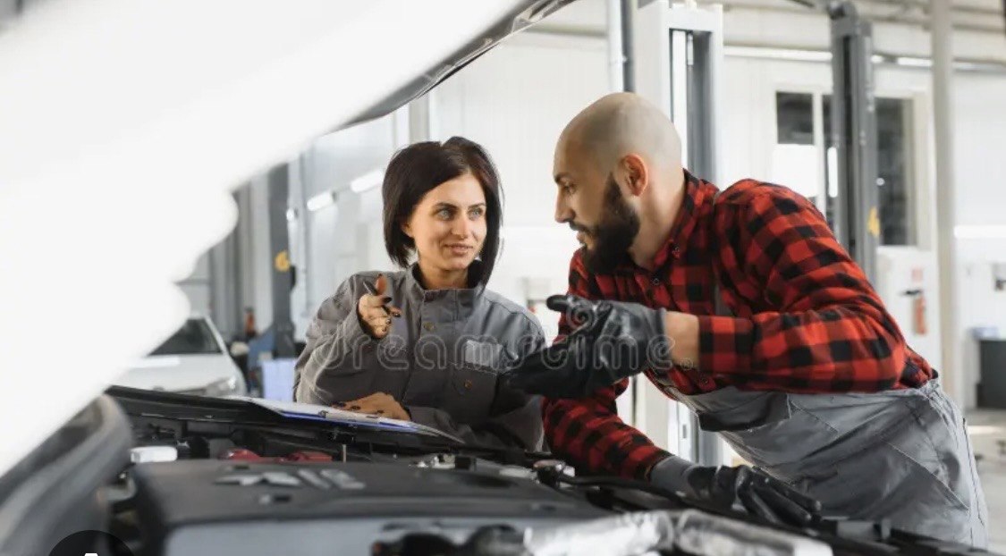 Technician explaining repair to customer